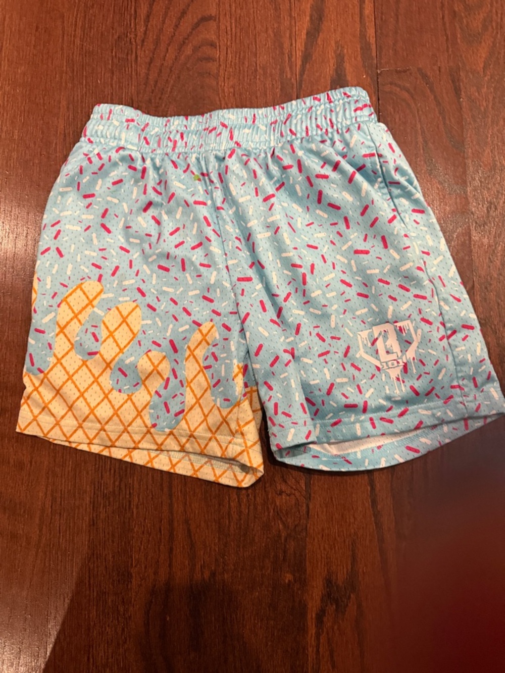 B101  drip Kids Light Blue Sprinkle Print Shorts with Orange Wafer Accent